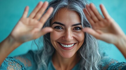 Middle age woman standing over blue background smiling making frame with hands and fingers with happy face creativity and photography concept : Generative AI