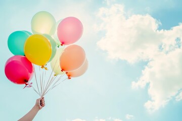 Colorful Balloons Floating in the Sky with Sunlight and Blue Skies, Evoking Joyful Celebrations and Festive Moments