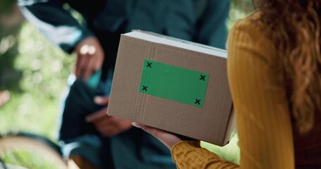 Hands, delivery and customer with box on green screen for shipping, logistics or mockup. Closeup, courier and giving person package for cargo, stock or ecommerce service with tracking markers at home - Powered by Adobe