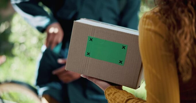 Hands, delivery and customer with box on green screen for shipping, logistics or mockup. Closeup, courier and giving person package for cargo, stock or ecommerce service with tracking markers at home