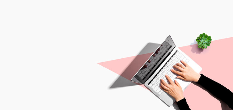 Person using a laptop computer from above