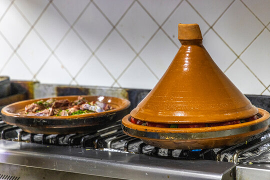 Morocco, Taroudant Province. Hotel Dar Zitoune, cooking food in a tagine