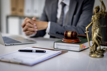 Close up of Judge gavel with Justice lawyers, Business senior man in suit or lawyer working on a documents. Legal law, advice and justice concept.
