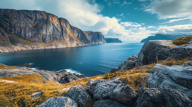 View of the fjord Rocky sea shore with blue cloudy sky Beautiful nature Norway Arctic bay Mageroya island Nordkapp Arctic ocean Horizontal banner : Generative AI