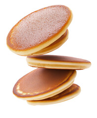 Pancakes flying close up on a white background.