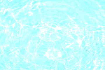 Blue water with ripples on the surface. Defocus blurred transparent blue colored clear calm water surface texture with splashes and bubbles. Water waves with shining pattern texture background.