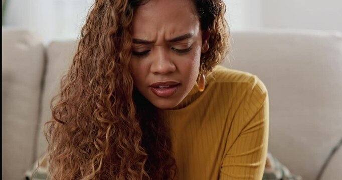 Phone, confused and woman with stress for spam, glitch or reading bad news or scam email on sofa in home. Mobile, frustrated and girl with connection fail, error 404 or cyberbullying on social media