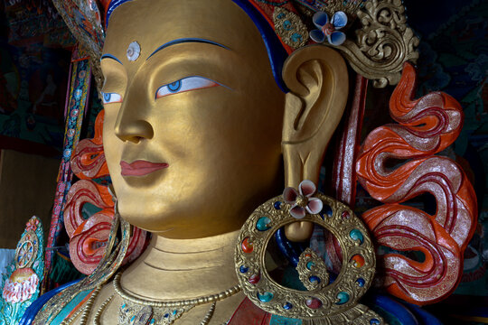 India, Ladakh, Indus Valley, Thiksey, Thiksey Monastery. Details of the Tibetan style statues and artifacts where people come to worship.