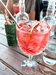 cocktail in vintage glass with friends