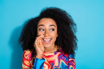 Photo portrait of beautiful woman with curly hair chevelure in trendy sweatshirt touch cheek look copyspace saying isolated on blue color background