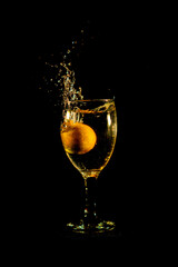 Water splash from orange drink glass