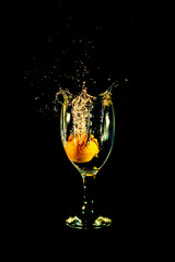 Water splash from orange drink glass