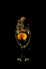 Water splash from orange drink glass
