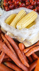 Texture of Sweet Corn Pile (Zea mays saccharata Sturt). Randomly stacked vegetables sold in Traditional Market. Textured Details. Fresh food ingredients. Wallpaper Backgrounds Photography Concepts