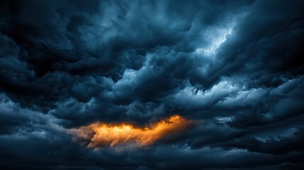 Fototapeta premium Dramatic Storm Clouds with a Burst of Orange Light at Sunset Creating a Stunning and Moody Sky
