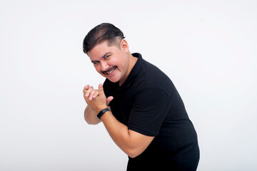 A scheming mastermind with a wicked grin bending down and rubbing his hands, relishing a plan...