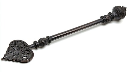 Ornate, intricately carved metal key with a heart-shaped bow