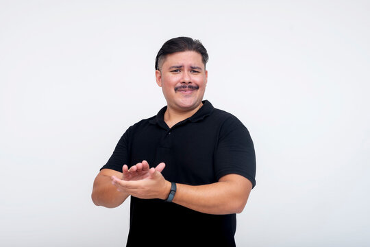 A middle-aged man clapping in a sarcastic manner, as if mocking a person's attempts or actions. Set against a white background.