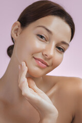 Beautiful Caucasian Woman with Flawless Skin Touching Her Face