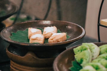 Indonesian cassava getuk cake topped with grated coconut. Getuk is a food made from cassava, boiled, then mixed with granulated sugar. served with grated coconut