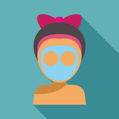 Woman with headband is wearing a blue facial cosmetic mask
