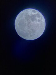Full moon at night with a dark background. Blue moon 