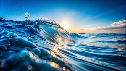 Close-up of a water wave against a blue sky with a lighter hue of blue representing the horizon