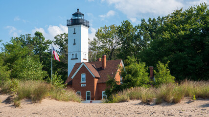 The 68 feet (21 m) tall Presque Isle Lighthouse is situated on the northern shoreline of Presque...