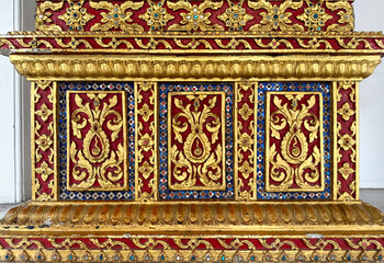 Close up of Thailand temple engraving and mural art pattern on wall, in different shapes, forms, and carved in every details, in various colors. Seamless background texture. 