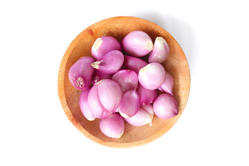 red onion in wooden plate on isolated white background. Perfect for recipes, articles or any cooking content.