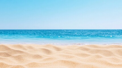 Obraz premium A beach with a blue ocean and a sandy shore