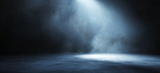 Fototapeta premium A single spotlight shines through a foggy, dark blue haze on a textured surface.