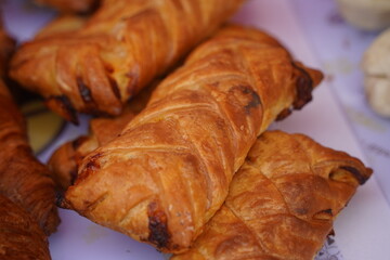 Sweet pastries with different fillings are laid out on the table.