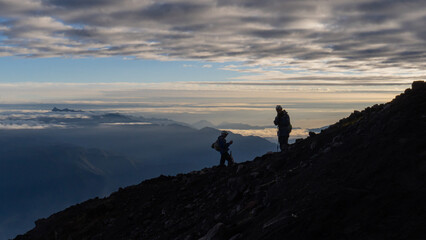 Silhouette of people in the mountains