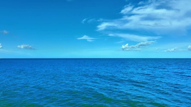 Nature of the beach and sea Summer with sunshine, sandy beaches, clear blue waters sparkling against the blue sky. On an island with good ecology and environment Background for summer vacation concept