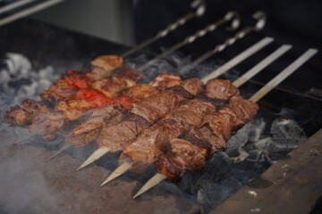 Roasting a barbecue on an open grill.