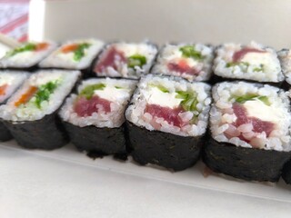 selection of fresh sushi on a white plate.High quality photo