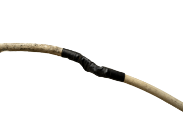 Damaged electrical cable is being repaired with black electrical tape to join both ends on transparent background