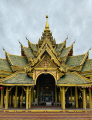 Naklejka premium Amazing famous Pavilion of the Enlightened, a green temple complex in Muang boran Ancient city, Samut Prakan, Bangkok, Thailand. Surrounded by a lake.