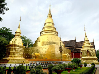 Fototapeta premium Famous golden pagoda of Wat Phra Singh at the heart of Chiang Mai, Thailand. Notably known for its golden Buddhist pagoda complex and revered Buddha statue.