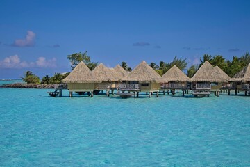 Crystal clear, turquoise waters fill the lagoon of Bora Bora