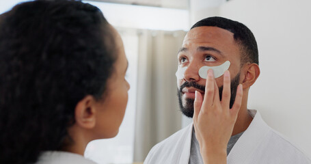 Home, couple and skincare with eye patches for hydration, dark circle or treatment to reduce puffiness. Bathroom, woman or man with cosmetics for beauty, wellness or bonding with face mask in morning