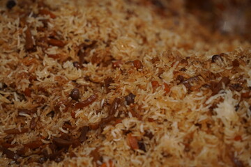 Ready pilaf in a large cauldron outside.