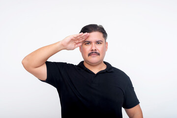 Fototapeta premium A middle aged man with a mustache making a salute. A possible war veteran or former soldier. Isolated on a white background.