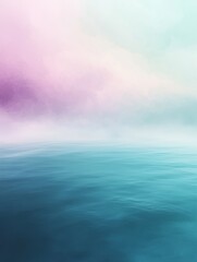 Obraz premium A tranquil ocean with soft pastel sky, gently fading from blue to pink, creating a peaceful and dreamlike atmosphere.