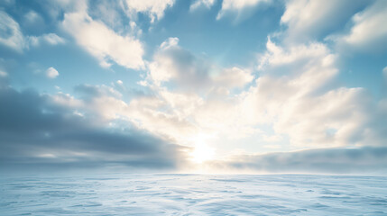 Naklejka premium A winter sky just after a snowfall, thick clouds with hints of sunlight breaking through, snow-covered landscape below
