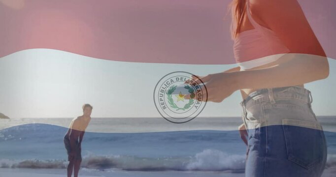 Paraguay flag animation over people enjoying beach activities