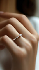 Close up of an elegant engagement diamond ring on woman finger
