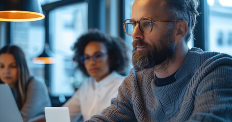 A diverse group of professionals gathered around an open desk, working together on an IT project in the office. Generative AI.