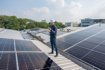 Engineer service check installation solar cell on the roof of factory. Silhouette technician...